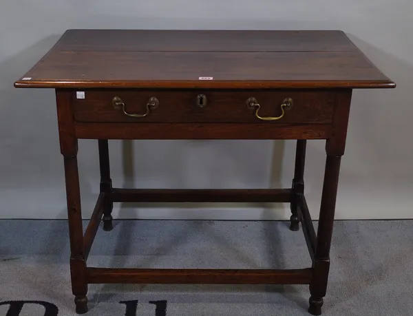 An 18th century oak single drawer side table on tapering supports 87cm wide x 69cm high.