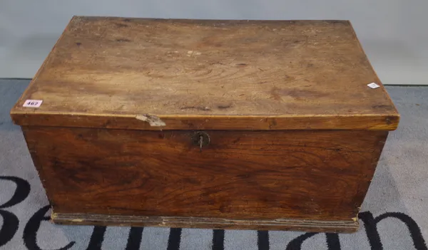 An early 20th century elm topped lift top trunk, 66cm wide x 62cm high.