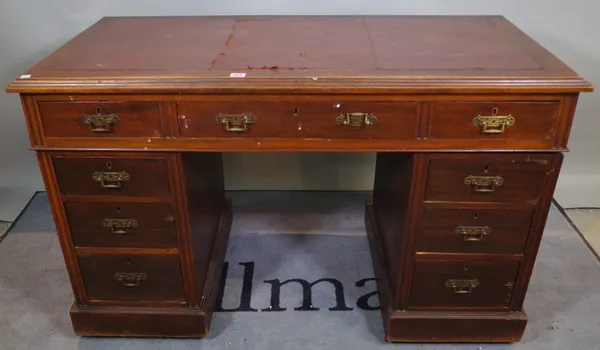 An early 20th century mahogany pedestal desk, with nine drawers about the knee, 126cm wide x 76cm high.