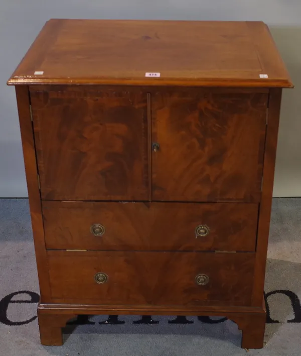 A George III mahogany lift top commode on bracket feet, 62cm wide x 78cm high.