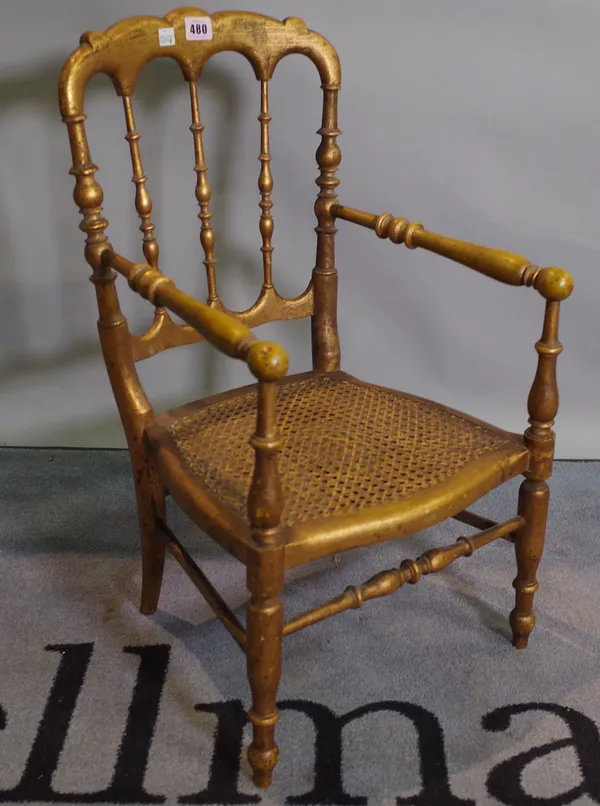 A Victorian child's gilt framed musical chair with turned supports 37cm wide x 65cm high.