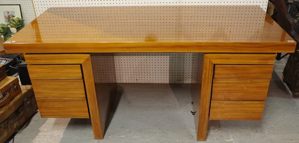 A 20th century walnut desk with two banks of three drawers, 170cm wide x 73cm high.