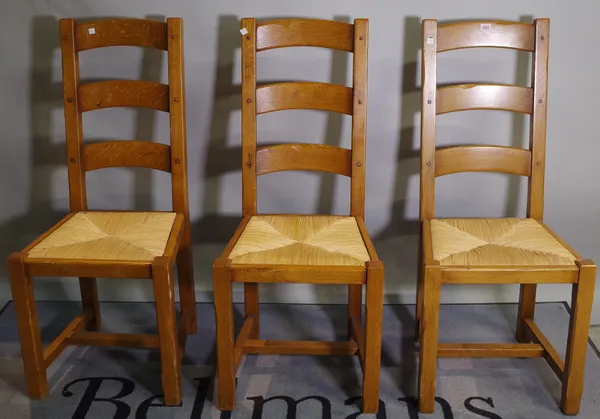 A set of six 20th century oak ladder back dining chairs, 45cm wide x 105cm high, (6).