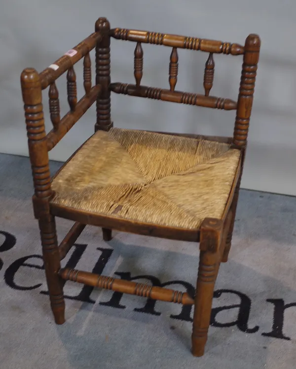 A 19th century turned beech rush seated corner chair, 41cm wide x 69cm high.