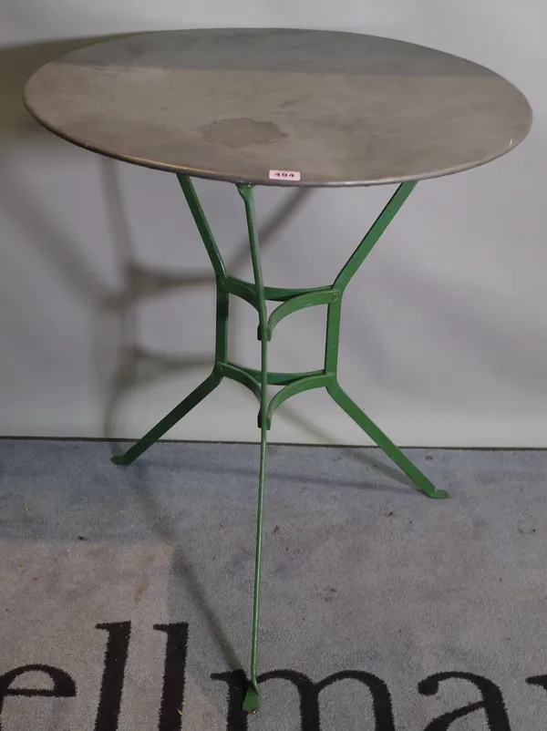 A 20th century French occasional table, the polished metal circular top on a green painted base, 63cm dia x 75cm high.