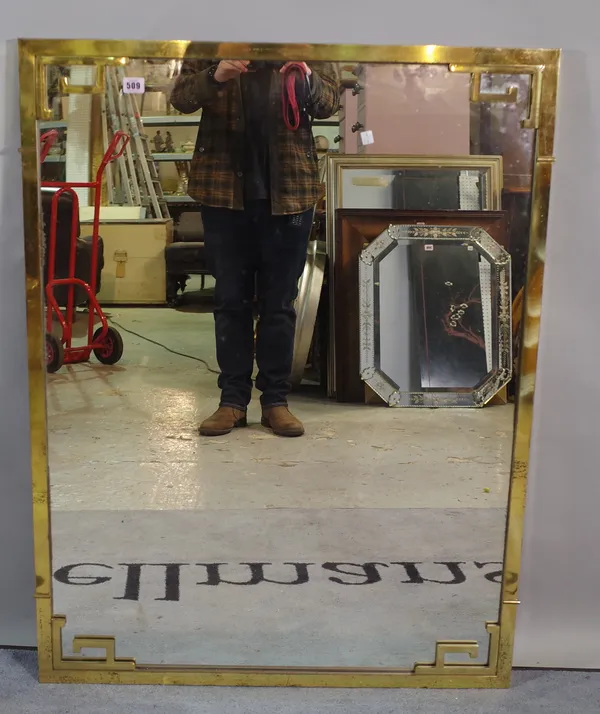 A 20th century brass framed wall mirror 108cm x 82cm.