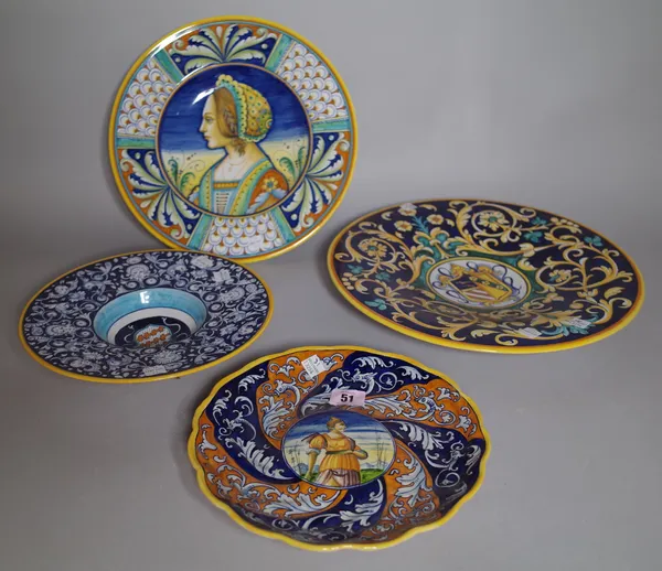 A group of four Deruta dishes, 20th century, in Renaissance maiolica style,  two painted with central armorials and two painted with female portraits,