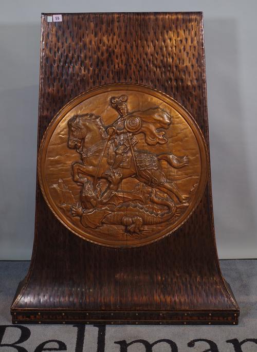 An early 20th century copper stand with circular embossed panel of George and the Dragon, 123cm wide.