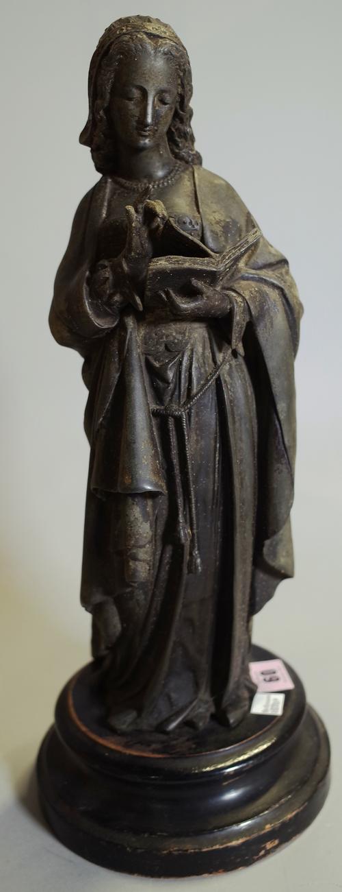 A 20th century bronze figure of a woman reading a book on circular plinth base, 41cm high.