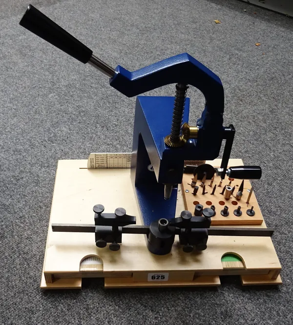 An Elma bushing toolWith two trays of bushes in the plywood base37cm wide