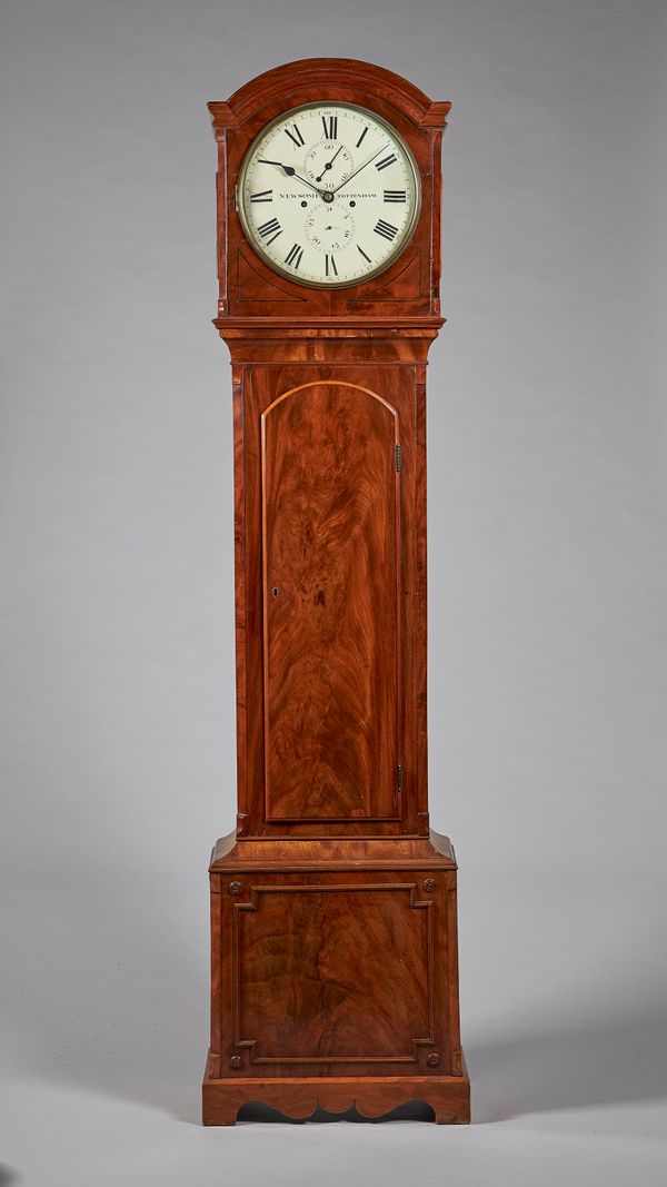 A late Regency mahogany longcase clockBy Newsome, TottenhamThe case with a shallow arch above a brass bezel and convex glass, flanked by canted angles