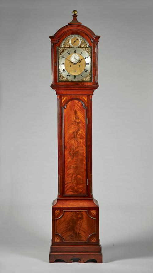 A George III mahogany longcase clockBy Thomas Batters, LondonThe well-figured case with an arched pediment, surmounted by a finial, above a glazed doo