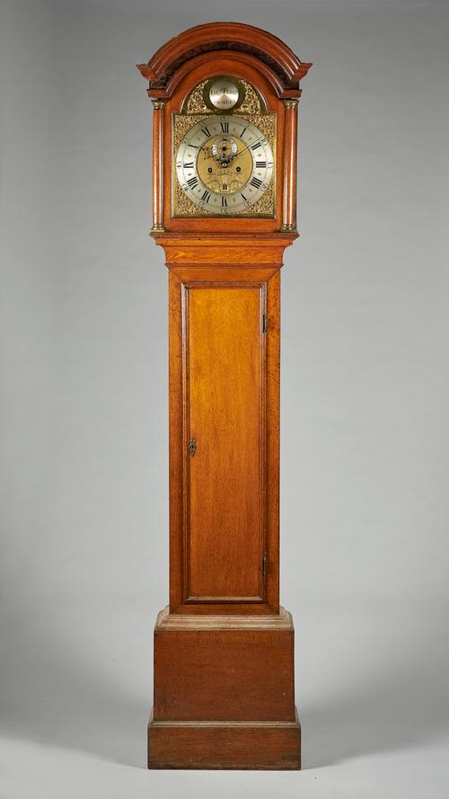 A George III oak longcase clockBy Thomas Peren, Smarden, circa 1770The case with an arched pediment above a pair of three-quarter columns and a glazed