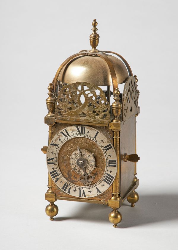 A miniature brass verge lantern timepiece with alarm In the late 17th century style, inscribed John Knibb, OxonOf usual form, with a turned finial and