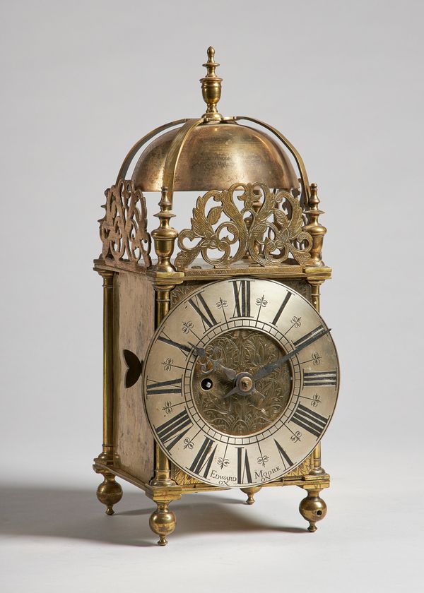 A brass lantern timepieceThe dial signed Edward Moore, Oxon, the frame 18th century, the movement late 19th centuryOf typical form, surmounted by a fi