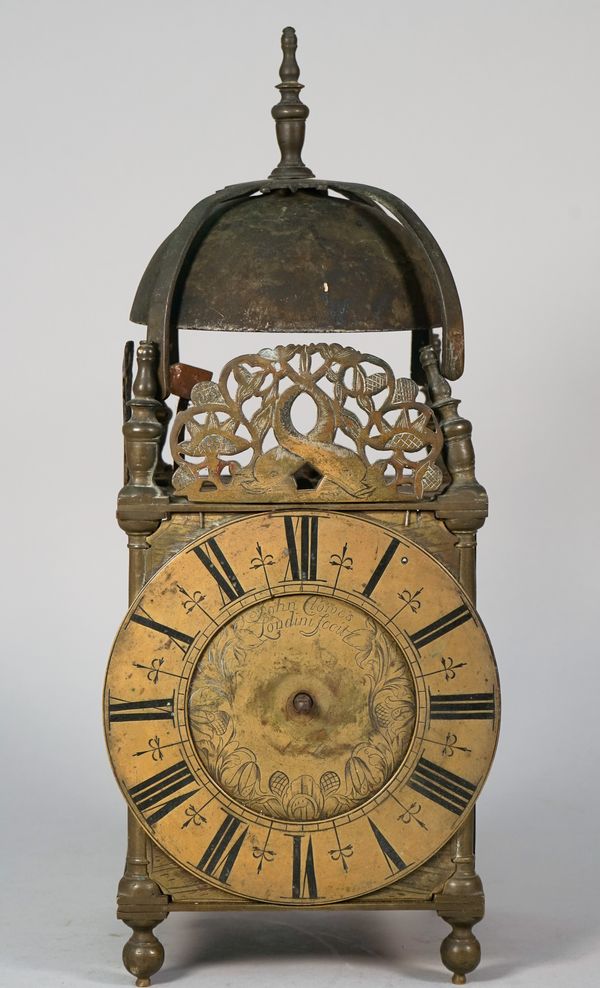 A William III brass lantern clockSigned John Clowes, London, circa 1690 With later finial above the bell-strap and bell, four turned finials above the