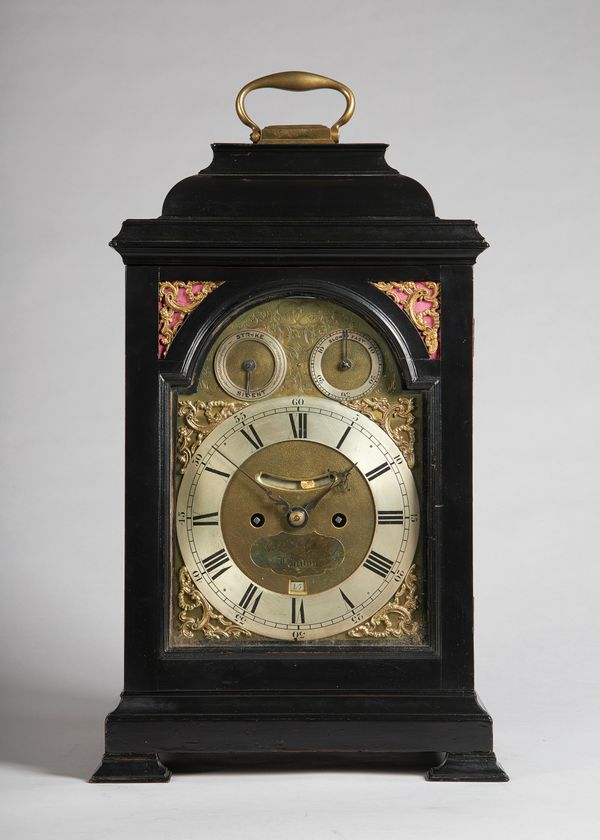 A giltmetal-mounted ebonised table clockTh movement inscribed John Berry, LondonThe case with a bell top surmounted by a brass carrying handle, above