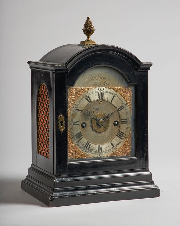 A George III ebonised bracket clock with alarmBy John Leroux, LondonThe arched case with a pineapple finial and moulded cornice, the 5 1/4in. dial sig