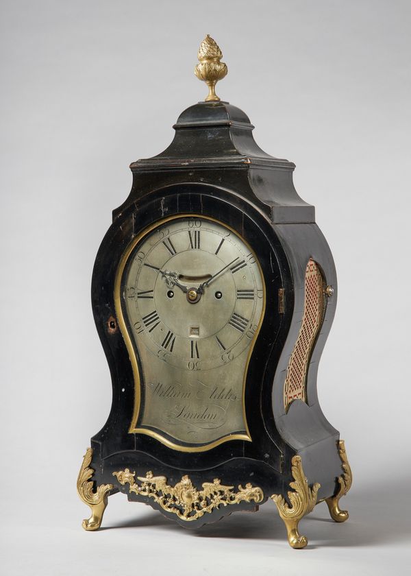 A George III giltmetal-mounted ebonised striking balloon clockBy William Addis, LondonThe case surmounted by an urn finial above square stepped domed