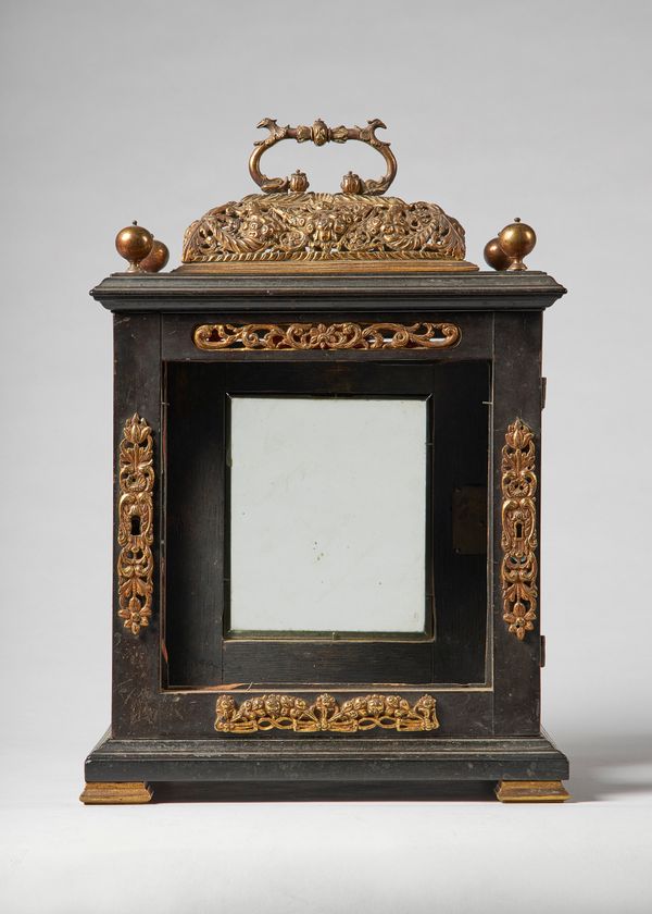 A giltmetal-mounted ebonised table clock caseLate 17th centuryWith pierced basket and four finials, on later block feet36cm high