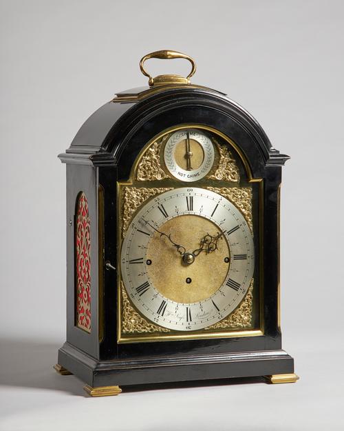 An Edwardian brass-mounted ebonised quarter chiming bracket clockThe dial inscribed Wm. Scafe, London, circa 1900The arched case surmounted by a singl