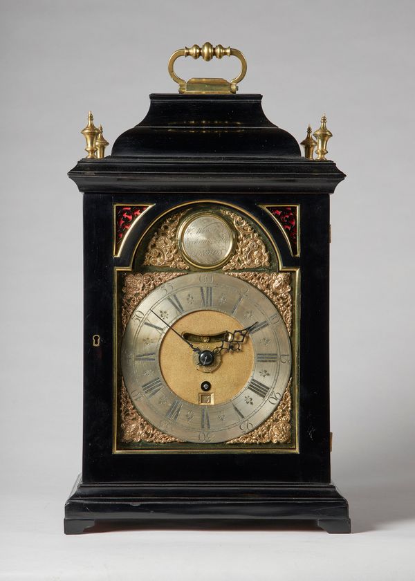 A gilt brass-mounted ebonised bracket timepiece with alarmThe movement by William Webster, LondonThe inverted bell-top case with a brass carrying hand