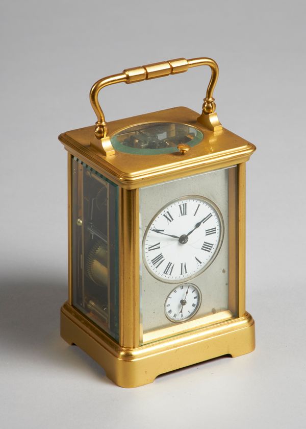 A French gilt brass cased carriage clockLate 19th centuryIn a Corniche case, the circular enamel dial and alarm dial within a silvered surround, the t