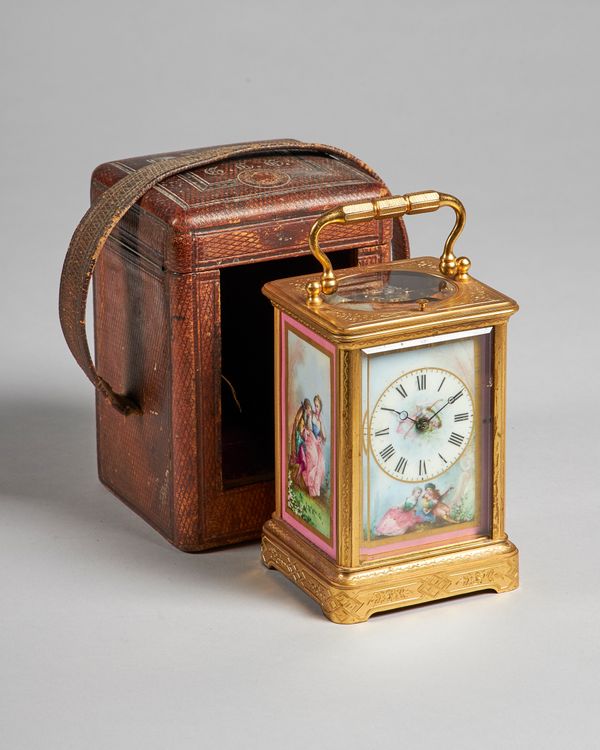 A French gilt brass and three-panel pink-ground porcelain carriage clockBy François-Arsène Margaine, Paris, circa 1890The Corniche case with foliate e