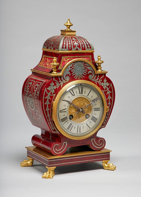 A French ormolu-mounted tortoiseshell and pewter-inlaid mantel clockIn the Regence style, in the manner of André-Charles Boulle, late 19th centuryThe