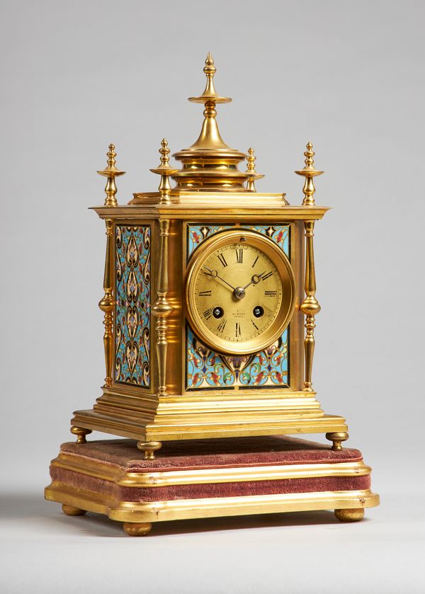 A French gilt brass and cloisonné enamel mantel clockBy Henry Marc, Paris, Circa 1870The rectangular case with five turned finials, with stepped pedim