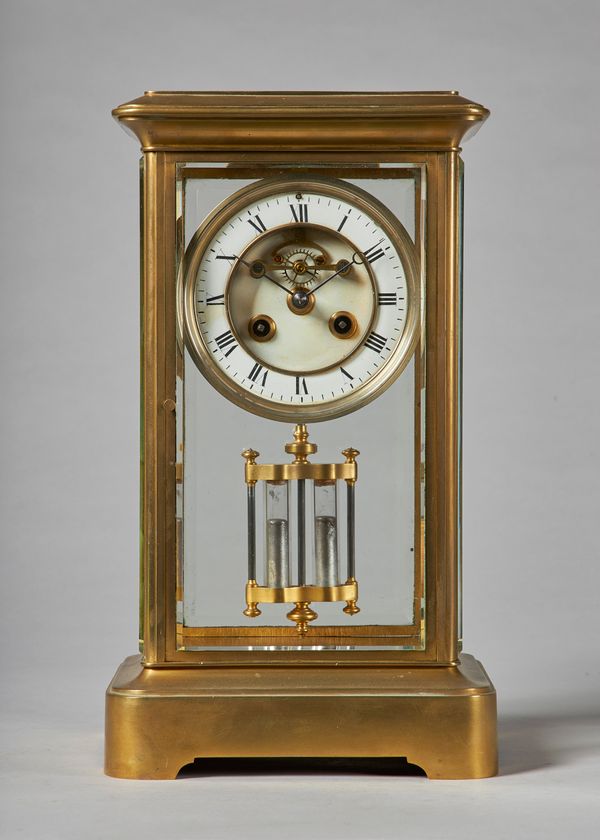 A French giltbrass four-glass mantel clockCirca 1870With a stepped pediment above bevelled glass panels, the white enamel chapter ring with Roman nume