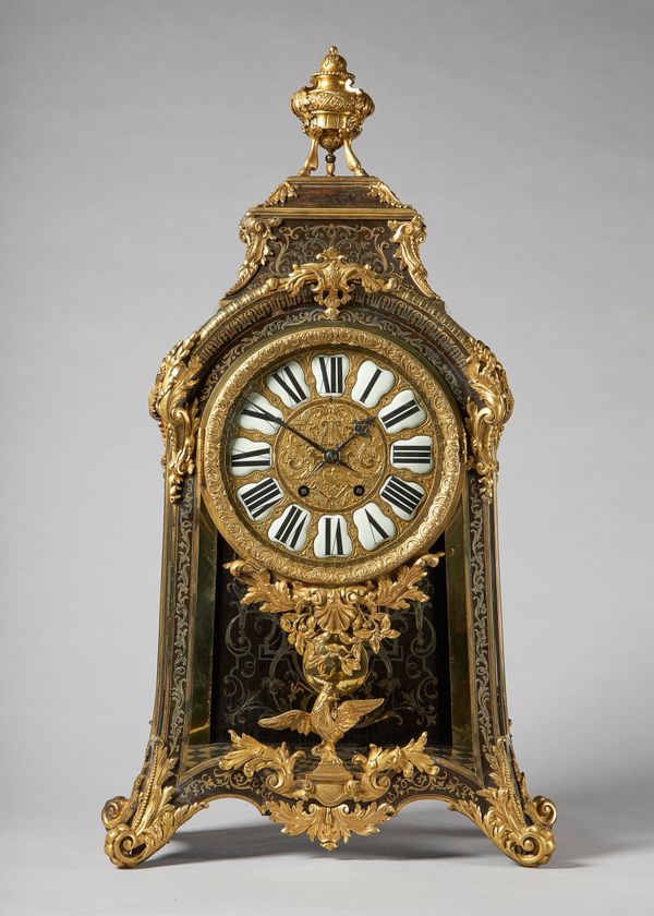 An ormolu-mounted, tortoiseshell and cut brass-inlaid mantel clockIn the Louis `XIV style, after André-Charles Boulle, second half 19th centurySurmoun