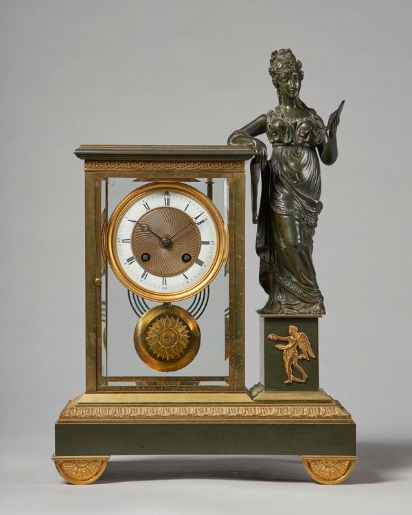 A French ormolu and bronze four-glass mantel clockIn the Empire style, circa 1890Modelled with a standing figure to the side, the rectangular case wit