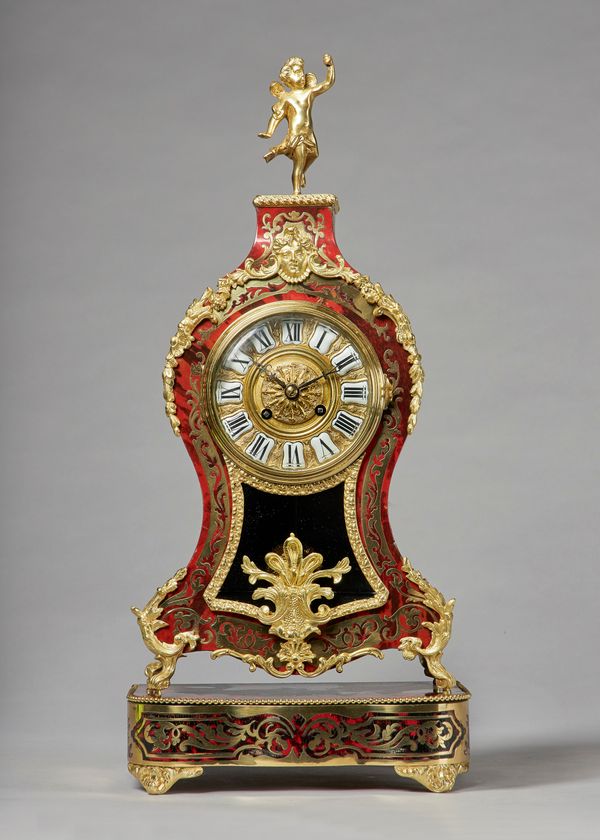 A French giltmetal-mounted tortoiseshell and cut brass-inlaid mantel clockIn the Louis XV style, circa 1870Surmounted by a winged figure, on square-sh