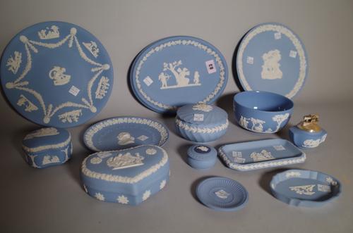 A group of Wedgwood blue jasper, 20th century, comprising; a bicentenary commemorative plate, 17cm diameter, a `Harvestman' plate, 22cm diameter, a ci