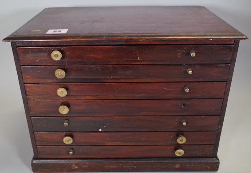 A 19th century mahogany seven drawer table top collector's chest, 37cm wide x 28cm high.