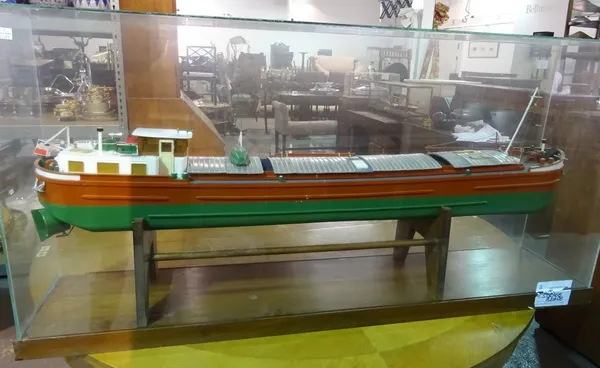 A large 20th century scratch built model of a French barge, Jocelyne, in a glass case, 127cm long x 65cm tall (a.f).