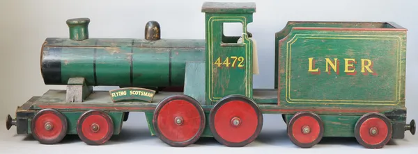 A scratch built wooden toy train, scale model, green painted, 'Flying Scotsman LNER 4472', 116cm overall.