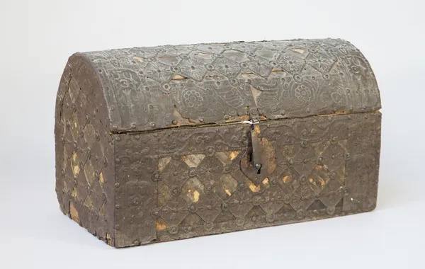 A Spanish domed casket, probably 18th century, embossed metal and cloth decoration with metal lock, 42cm wide, (a.f.).