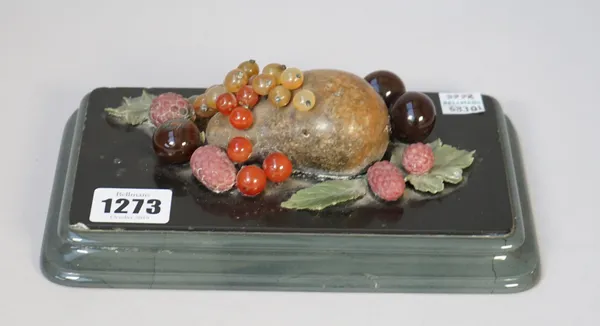 An Italian hardstone desk ornament, late 19th century, formed as a cluster of fruit including a pear, grapes and raspberries in agate, jasper, corneli