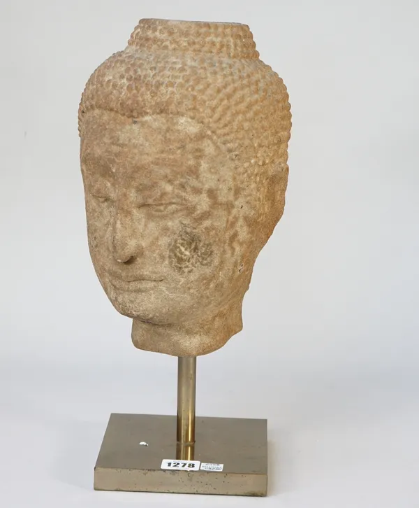 A modern stone Buddha head on a gilt metal stand, head 28cm high.