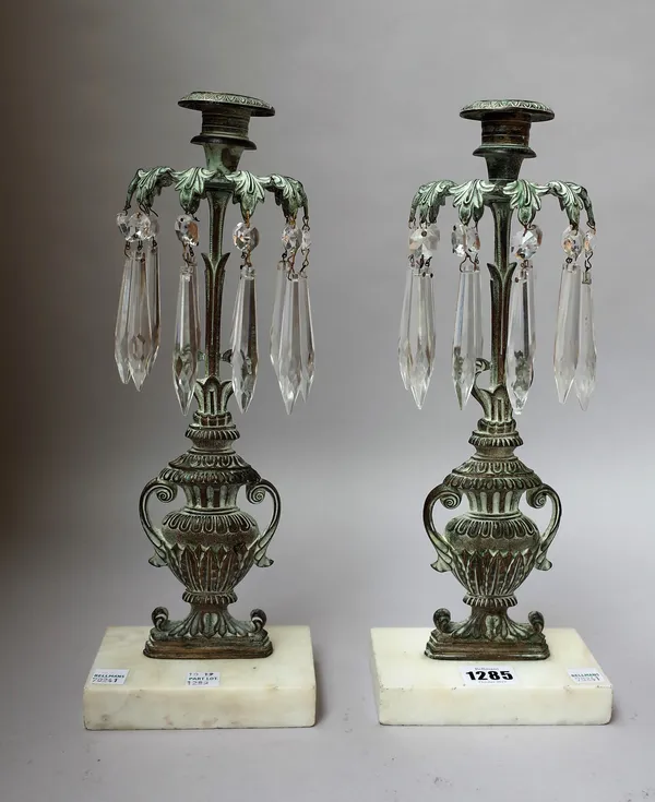 A pair of Georgian style gilt metal candlestick lustres of pierced urn form on a white marble plinth, 33cm high, (2).