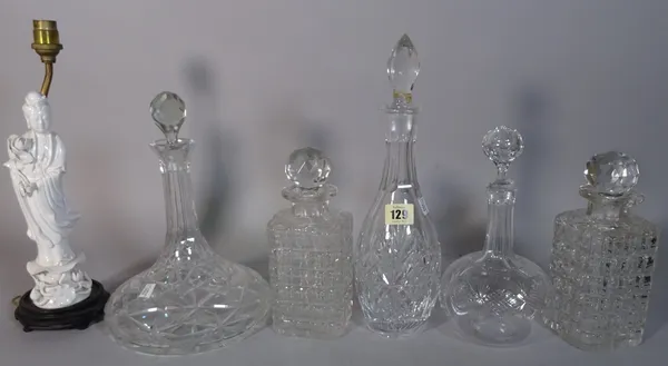 A group of ten assorted 20th century cut glass decanters and two blanc de chine style figures made into lamps, (12).