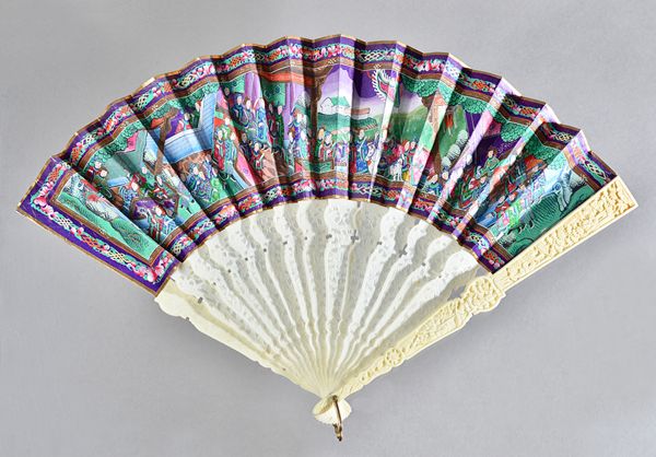 A Chinese Canton ivory fan, early 20th century, painted landscape on paper, the figures with painted ivory faces, double sided, with foliate carved an