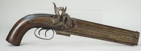 A mid-19th century percussion pistol with over and under twin steel barrels, 21cm, foliate engraved lockplate and percussion cap storage to the cheque