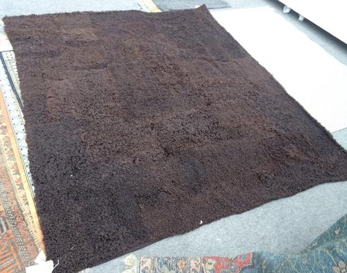 A sheepskin throw, 207cm x 180cm.