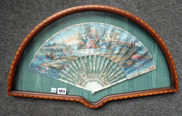 An 18th century painted paper fan depicting a family against a landscape with polychrome painted pierced ivory sticks, (27cm), in a glazed mahogany ca