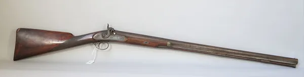 A 19th century percussion action rifle with plain two stage steel barrel, 77cm, foliate engraved steel lockplate and checkered walnut grip, 118cm over