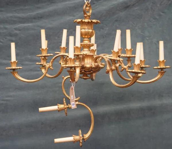 A William IV style eight branch gilt bronze chandelier, the foliate cast body issuing sixteen lights on eight graduated branches, (a.f.), 44cm high.