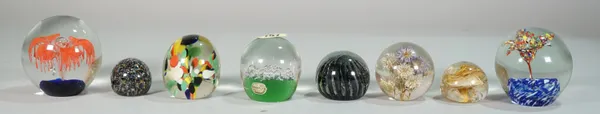 A large quantity of mostly 20th century glass paperweights of various sizes and designs, (34).